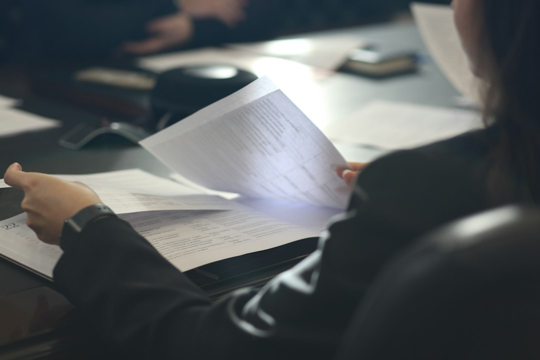 Woman reviewing paperwork at a desk